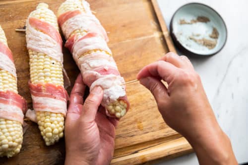 Wrap bacon around corn