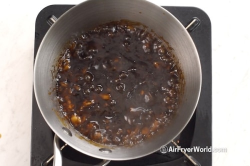 Sauce bubbling in pan