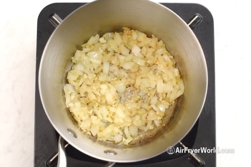 Cooked onions, garlic, and ginger in saucepan
