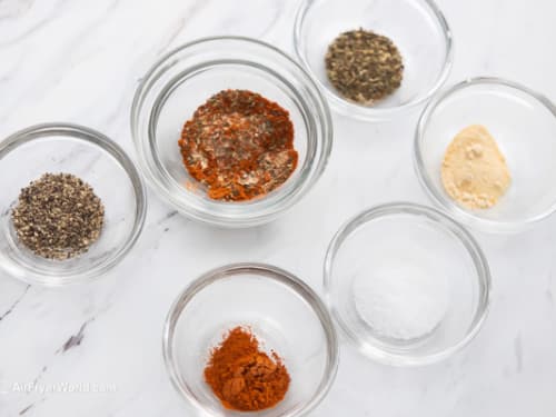 Spices for recipe in small bowls