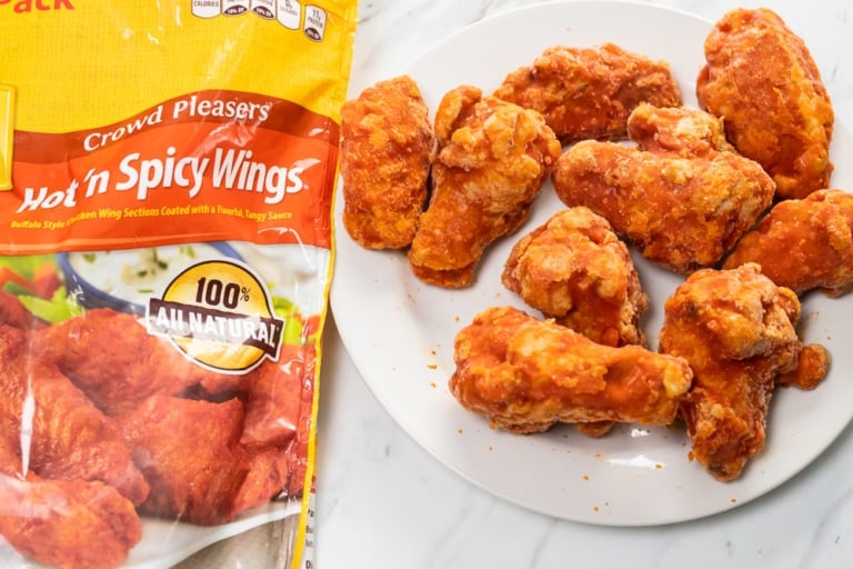 Bag and plate of pre-cooked frozen chicken wings