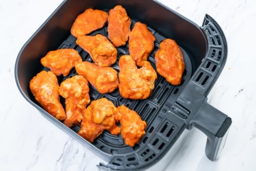 Partially cooked chicken wings from frozen in air fryer basket
