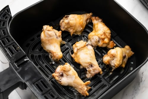 Half cooked chicken wings from frozen in air fryer basket