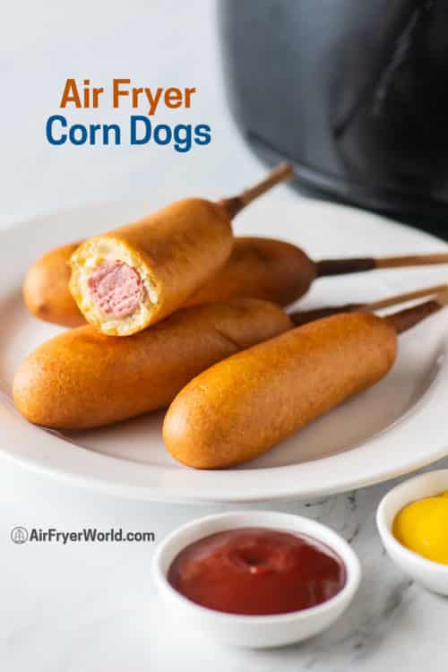 Corn Dogs on a plate with ketchup and mustard