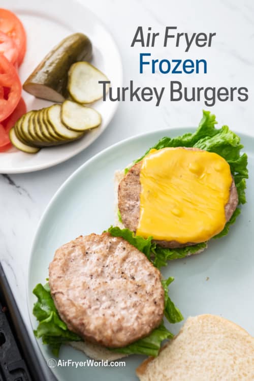 Plated turkey burgers with burger toppings