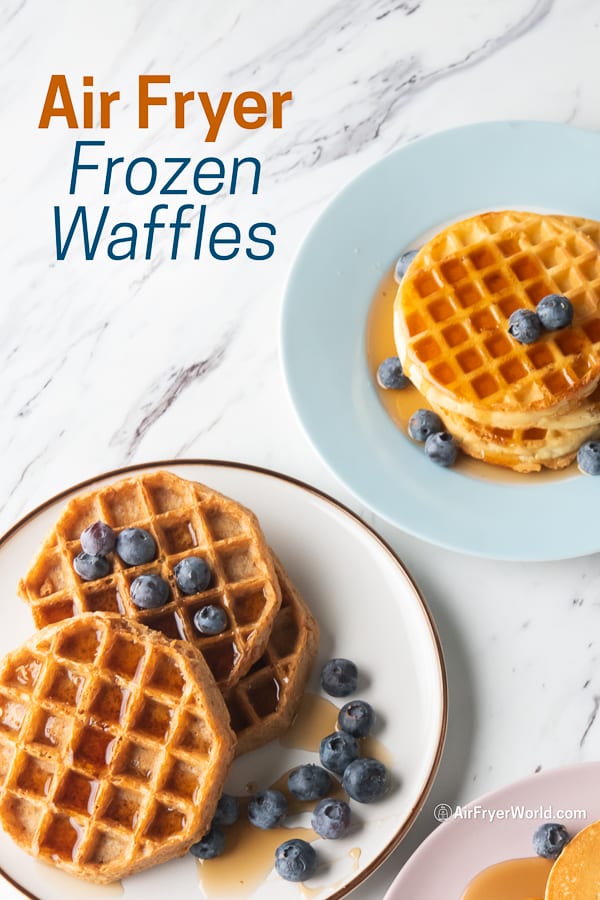 Waffles with syrup and berries on a plate