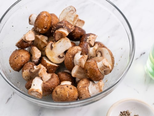 Seasoned cut mushrooms in a bowl