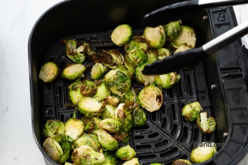 Stirring partial cooked brussels sprouts in air fryer