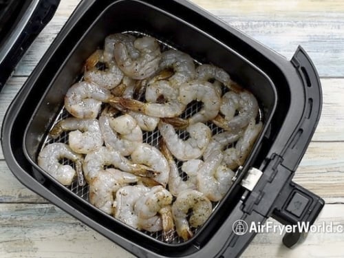 Raw shrimp in air fryer basket