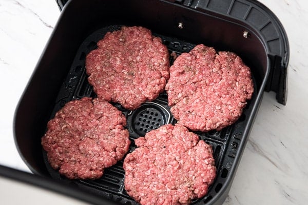 Uncooked patties in the air fryer