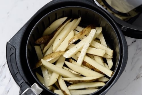 Uncooked fried in air fryer basket