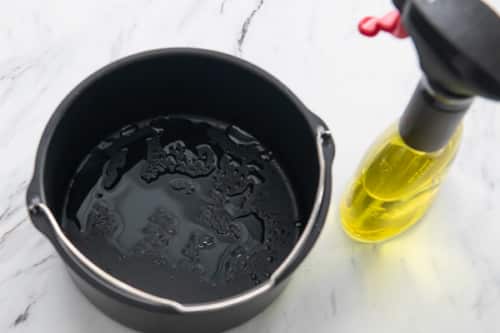 Bucket pan sprayed with oil