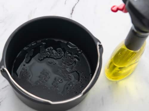 Bucket pan sprayed with oil