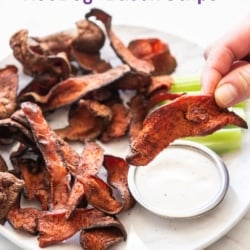 holding piece of crispy hot dog bacon chip from air fryer
