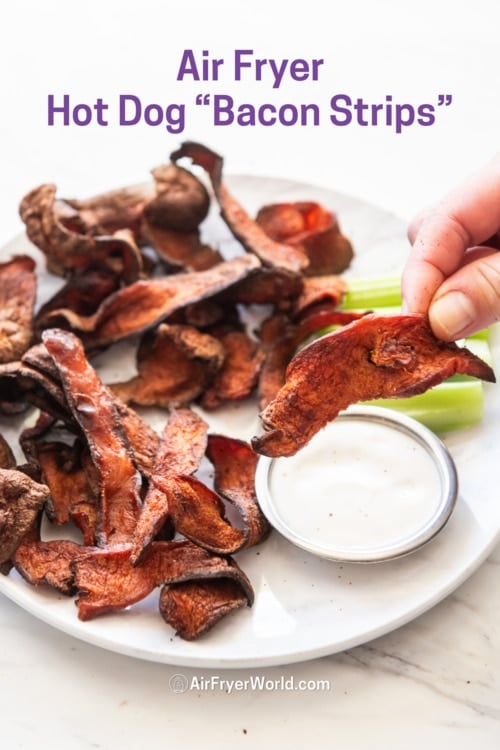 holding piece of crispy hot dog bacon chip from air fryer