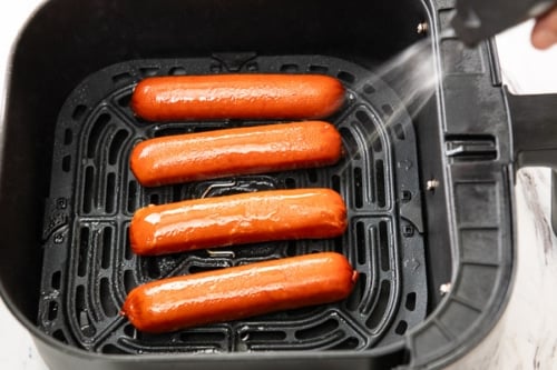 Coating hot link sausages with oil