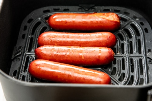 Fully cooked hot link sausages in air fryer basket