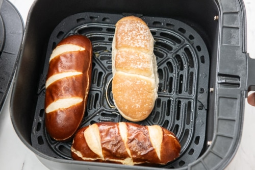Sausage dog buns in air fryer basket