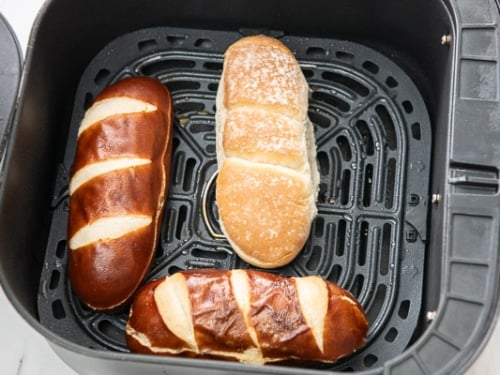 Sausage dog buns in air fryer basket