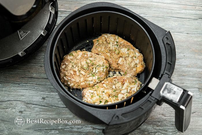 Uncooked pork chop in air fryer