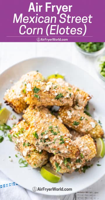 Tray of Air fryer Elotes recipe Mexican Street Corn with Mexican cheesy cream on top from airfryerworld.com