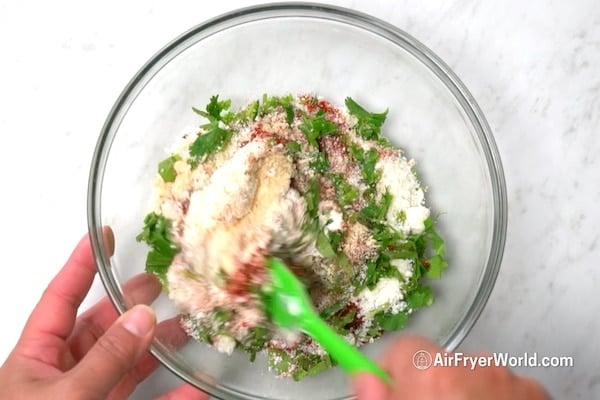 Mixing elotes dressing