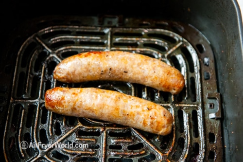 Fully cooked sausage in air fryer basket