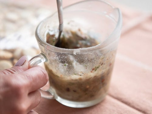 Oil and seasoning mix in a mixing glass