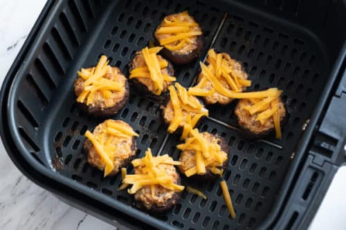 Stuffed mushrooms in Air Fryer with cheese on top