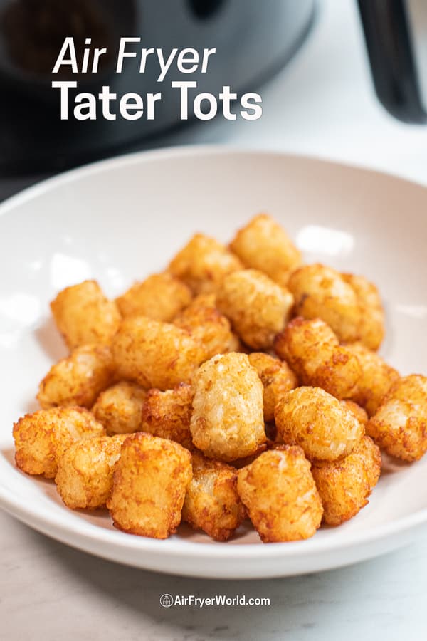 Air fried frozen tater tots in the air fryer in a bowl