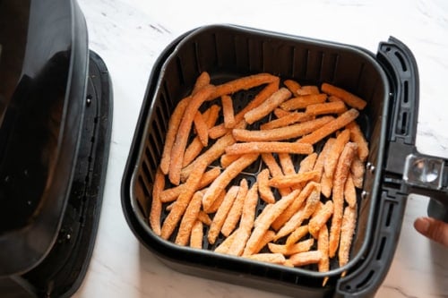 Frozen sweet potato fries in a single layer