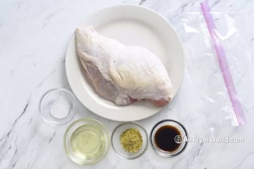 Raw turkey breast on a plate