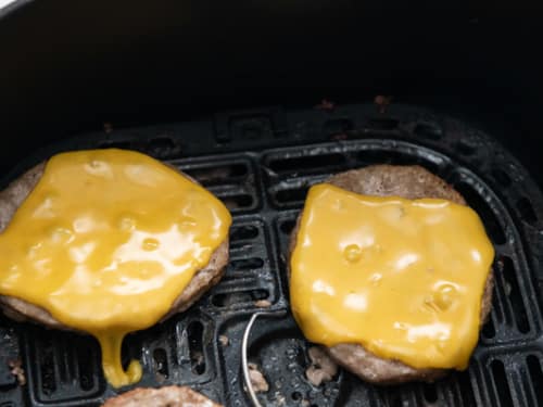 Cheese melted onto turkey patties in air fryer
