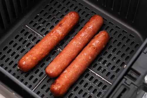 Cooked hot dogs in air fryer basket