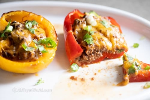 Cooked stuffed peppers sliced on a plate