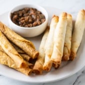 Cooked taquitos and flautas with salsa