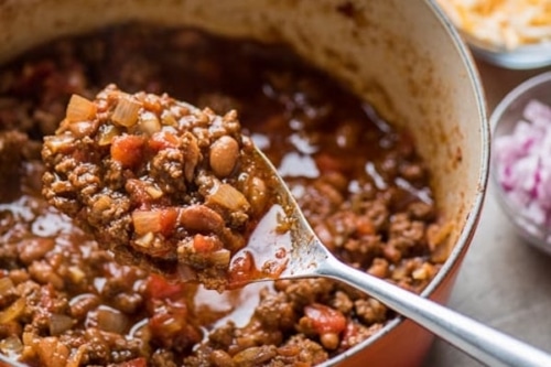 Chili in a large spoon over pot