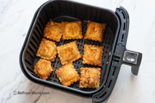 crispy ravioli in air fryer basket 