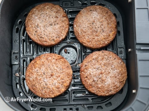 Cooked Impossible burgers in the air fryer basket