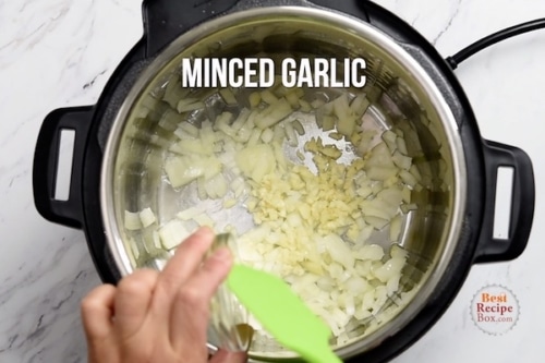 Garlic being added to instant pot