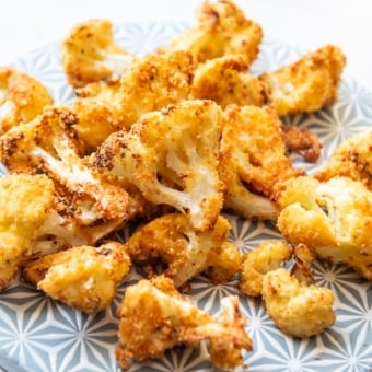 cooked keto air fryer cauliflower bites on plate