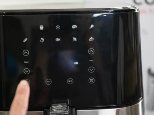 Touching panel to preheat air fryer