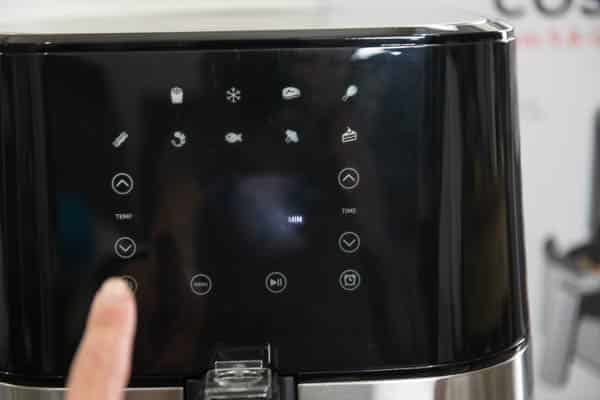 Touching panel to preheat air fryer
