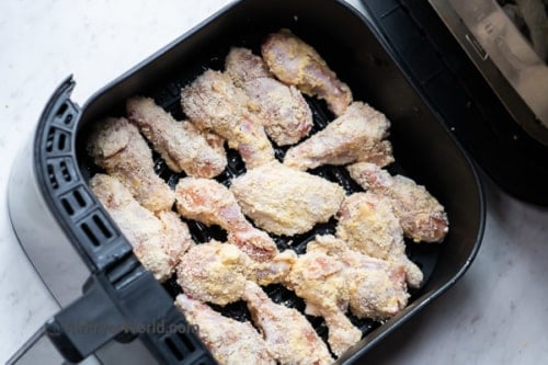 Uncooked parmesan wings in air fryer