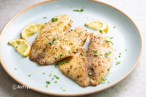 Cooked tilapia filets on a plate
