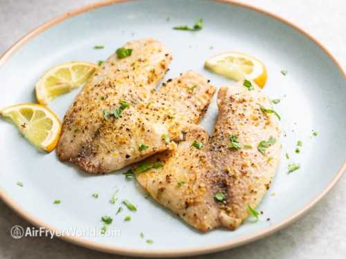 Cooked tilapia filets on a plate