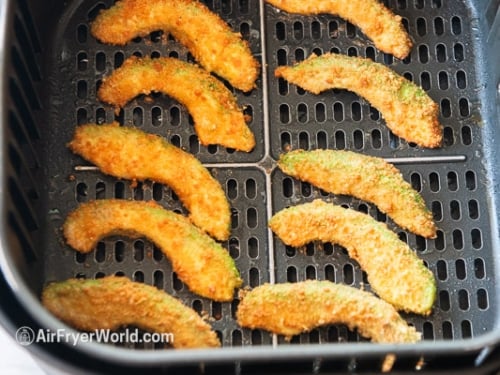 Half cooked avocado fries in air fryer