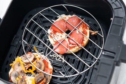 Wire rack over pizza topped bagel in air fryer