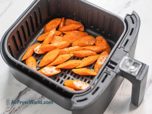 raw carrots in air fryer basket