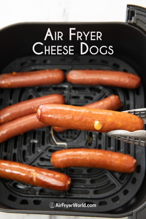 holding air fryer cheese dogs with tongs 